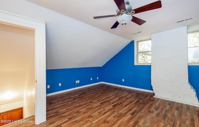 bonus room featuring wood finished floors, visible vents, and a healthy amount of sunlight