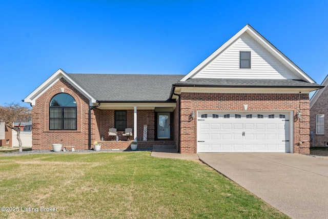 view of front facade with driveway, a porch, a front lawn, a garage, and brick siding