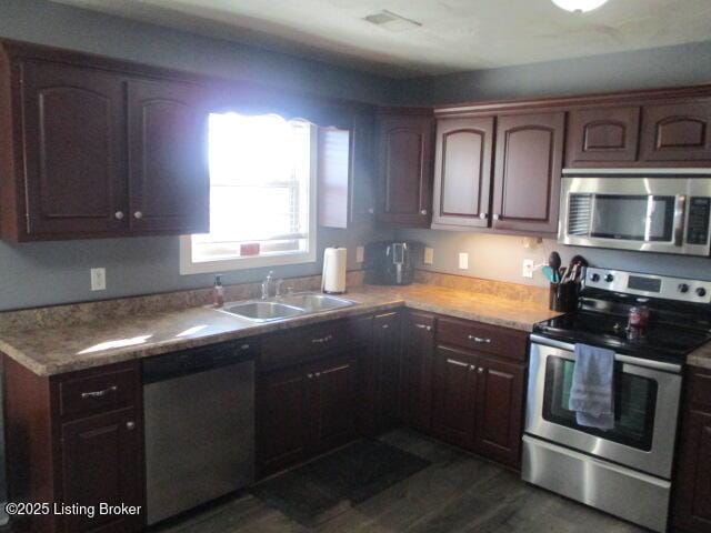 111 Pete Ln, Bardstown, KY 40004 - kitchen featuring dark brown cabinetry, stainless steel appliances, light countertops, and a sink