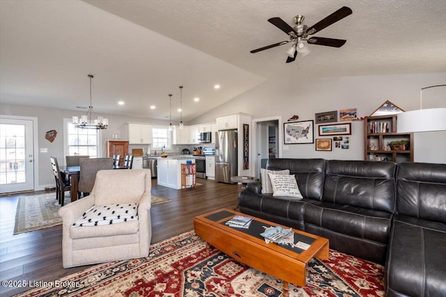 living room with lofted ceiling, recessed lighting, dark wood-style flooring, and a textured ceiling