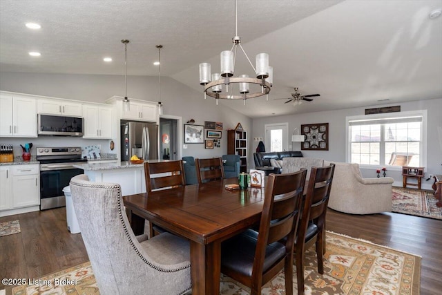 dining area with lofted ceiling, recessed lighting, dark wood-style flooring, and a textured ceiling