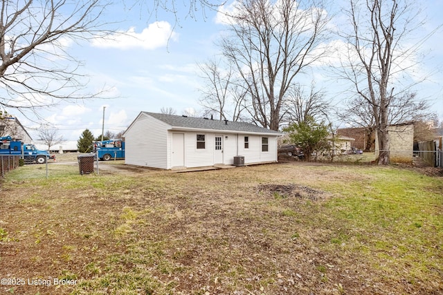 back of property featuring a yard, a fenced backyard, and cooling unit