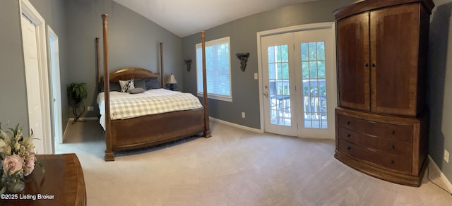 carpeted bedroom with baseboards, access to outside, and vaulted ceiling