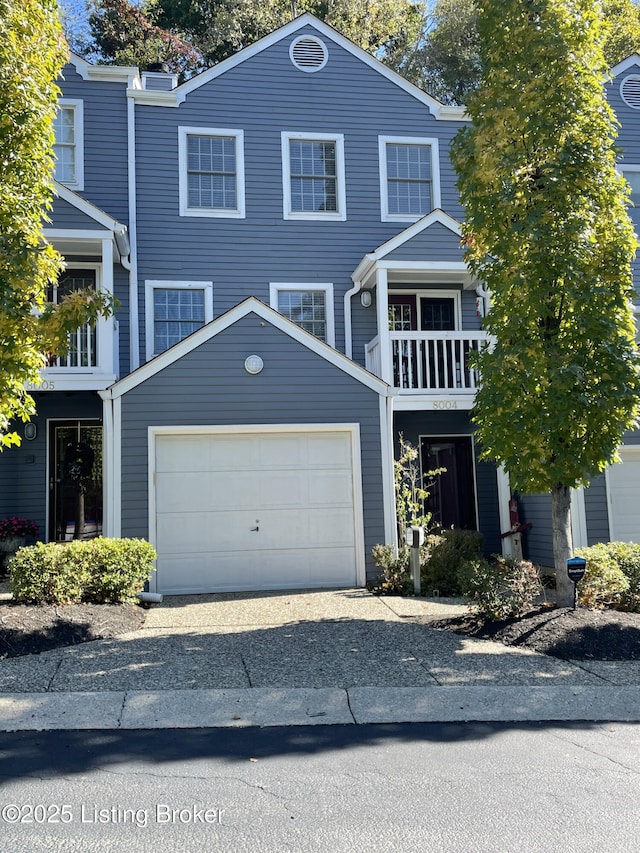 view of front of home with a balcony and driveway