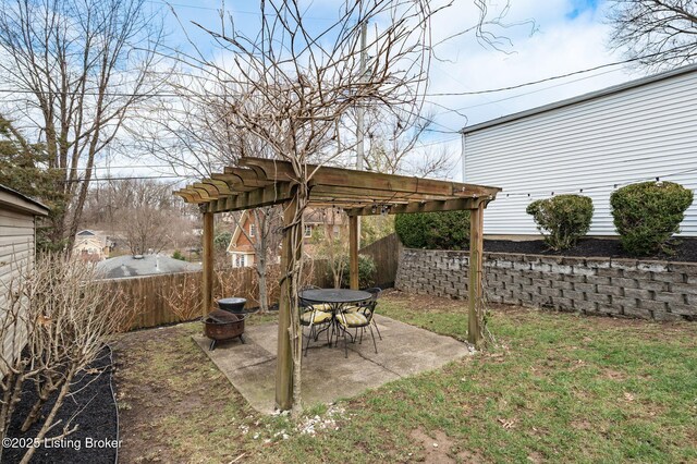 view of yard with a patio, fence, a pergola, and a fire pit