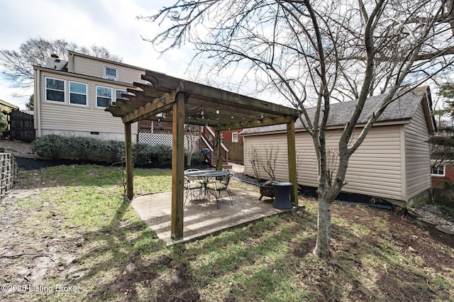 view of yard with a fire pit, a pergola, a patio, and fence