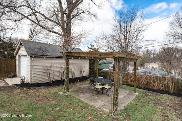 view of yard featuring a patio area, an outdoor structure, and fence