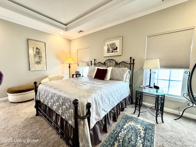 bedroom with visible vents, baseboards, carpet flooring, and crown molding