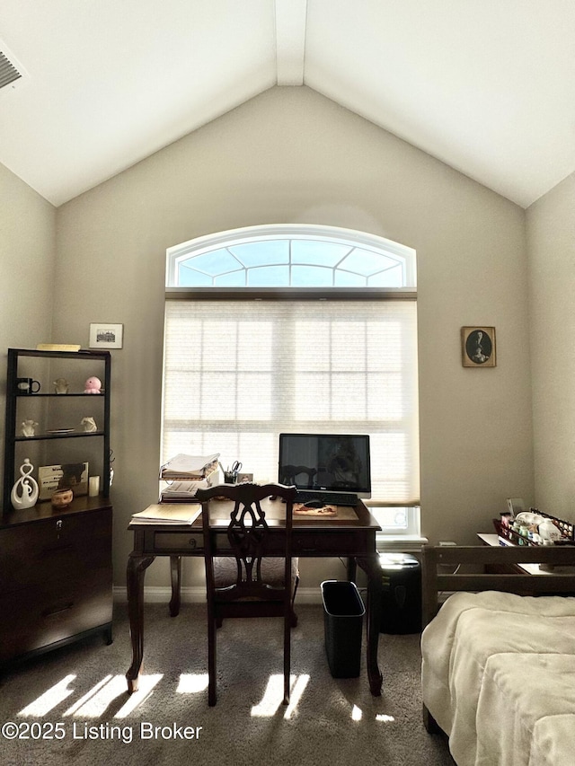 carpeted home office featuring visible vents, baseboards, and vaulted ceiling