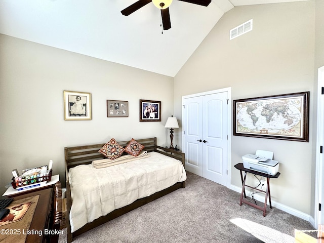 bedroom featuring baseboards, visible vents, high vaulted ceiling, a closet, and carpet flooring