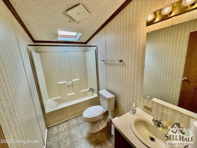 full bathroom with toilet, a textured ceiling, a skylight, crown molding, and wallpapered walls