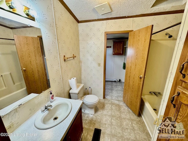 full bath featuring wallpapered walls, toilet, vanity, ornamental molding, and a textured ceiling