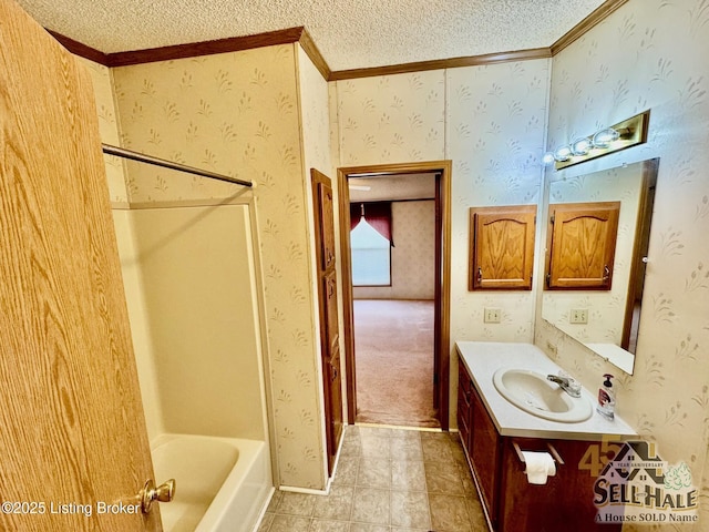 full bath featuring vanity, baseboards, wallpapered walls, a textured ceiling, and tile patterned floors