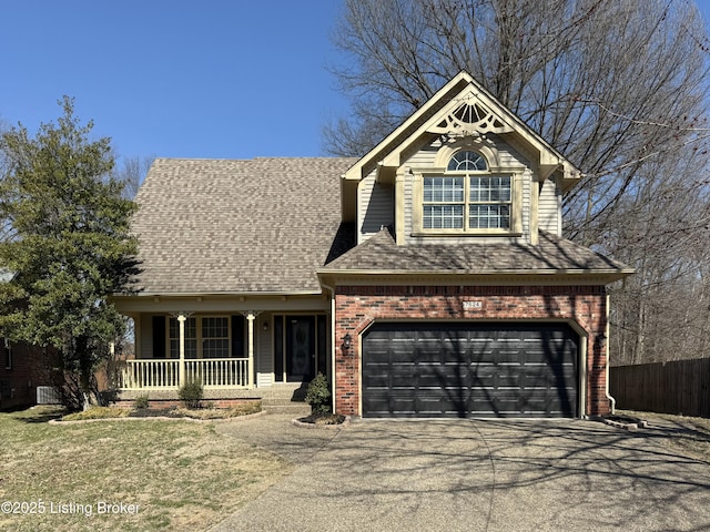 view of front of house featuring brick siding, fence, a porch, roof with shingles, and driveway