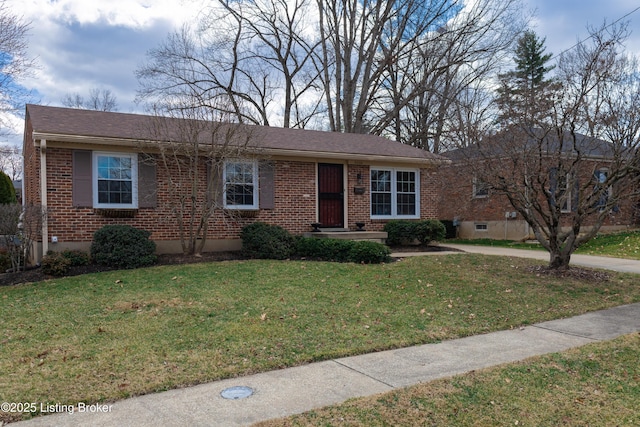 ranch-style house featuring brick siding and a front lawn