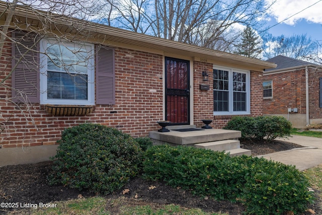 view of front of home featuring brick siding