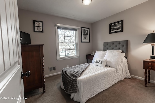 carpeted bedroom with visible vents and baseboards