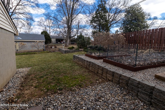 view of yard featuring a garden and fence