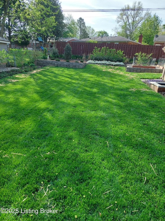 view of yard with fence