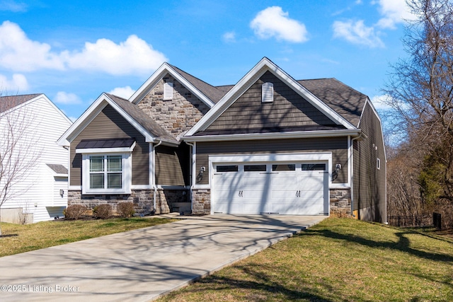 craftsman-style house featuring stone siding, an attached garage, concrete driveway, and a front lawn