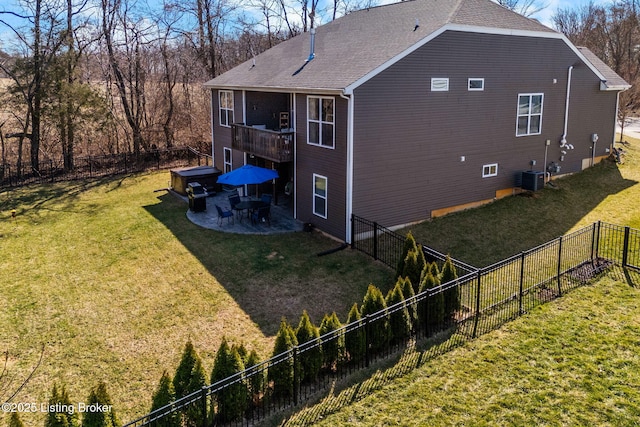 view of home's exterior featuring cooling unit, roof with shingles, a yard, a fenced backyard, and a patio area