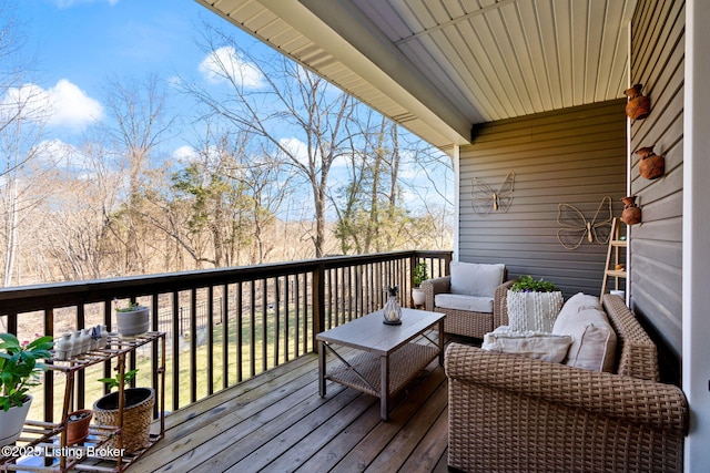 wooden deck with outdoor lounge area