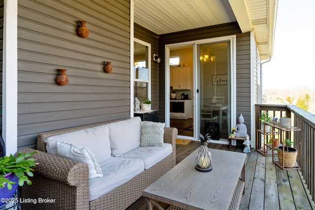 wooden terrace with outdoor lounge area