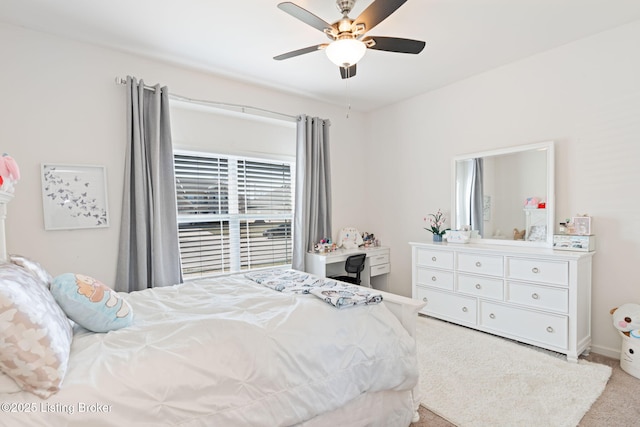 carpeted bedroom featuring ceiling fan