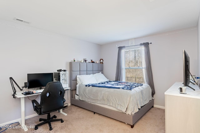 carpeted bedroom featuring baseboards and visible vents