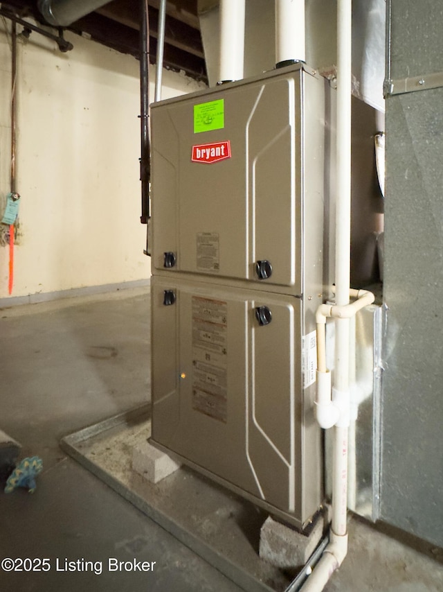 utility room featuring heating unit