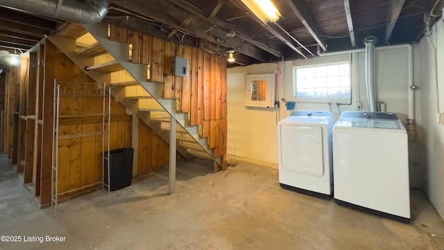 basement featuring washer and dryer and stairs