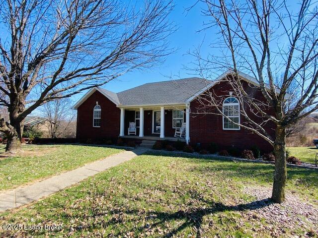 view of front of home featuring a porch and a front lawn