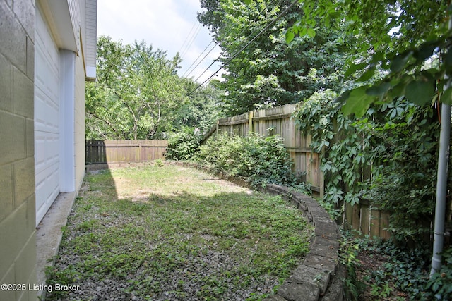 view of yard with a fenced backyard