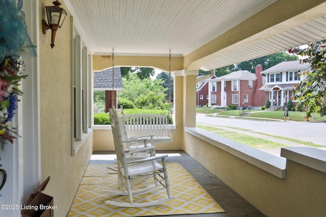 view of patio featuring a residential view and a porch