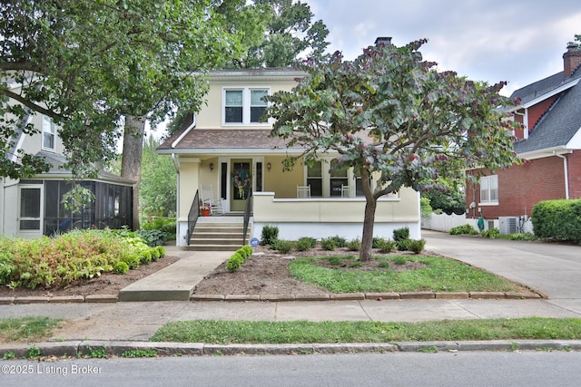 view of front of house with covered porch and stucco siding