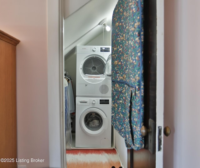 clothes washing area with laundry area and stacked washing maching and dryer