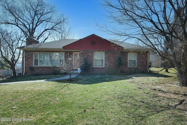 single story home featuring fence, a shingled roof, a chimney, a front lawn, and brick siding