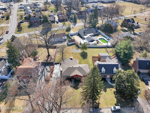 birds eye view of property with a residential view