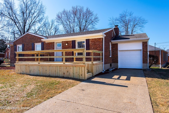 view of front of property with a wooden deck, a chimney, concrete driveway, a garage, and brick siding