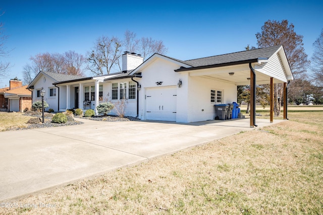 view of front of property featuring a front lawn, concrete driveway, an attached garage, brick siding, and a chimney