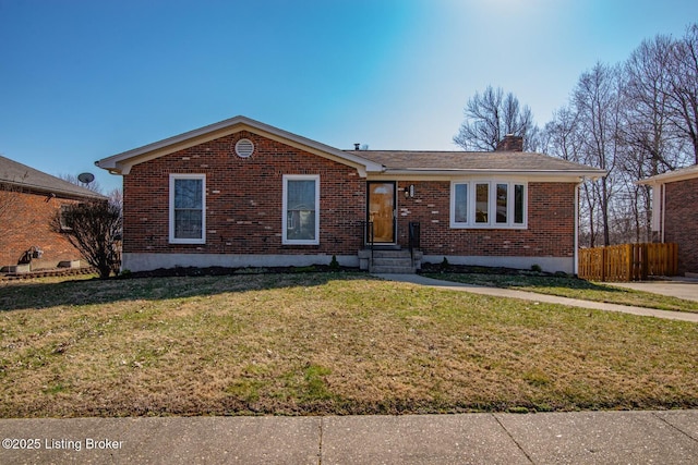 single story home featuring brick siding, a chimney, a front yard, and fence