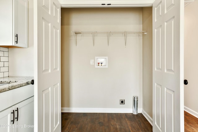 clothes washing area with hookup for a washing machine, baseboards, hookup for an electric dryer, laundry area, and dark wood-style flooring