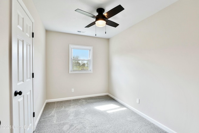 unfurnished bedroom with carpet flooring, baseboards, visible vents, and a ceiling fan