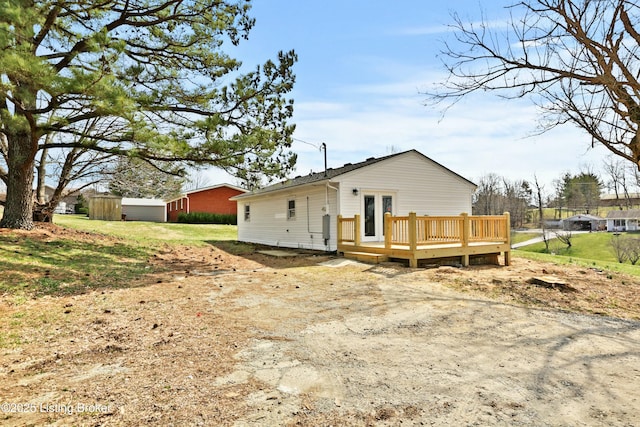 exterior space with french doors and a wooden deck