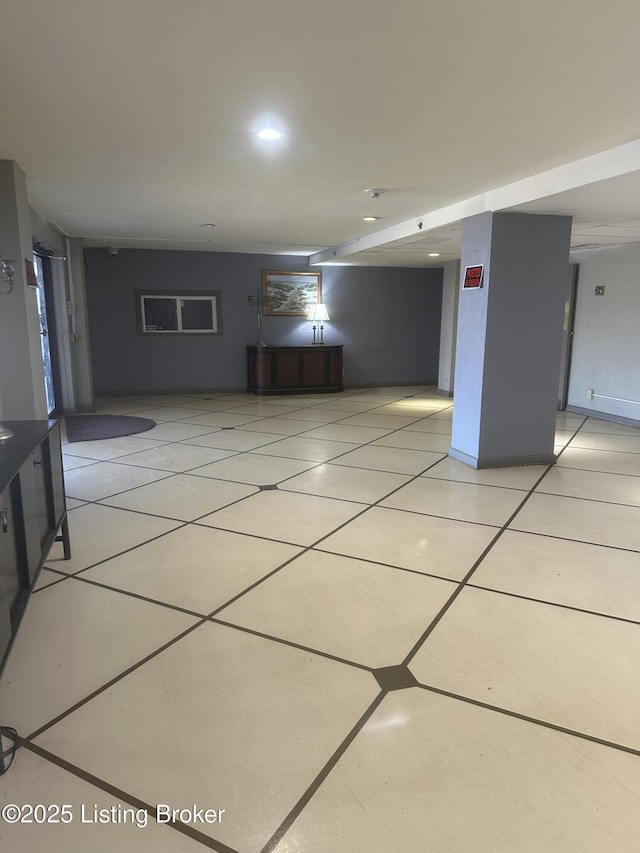 interior space featuring light tile patterned floors and recessed lighting