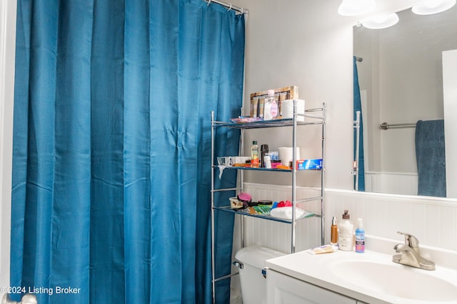 bathroom with vanity and wainscoting