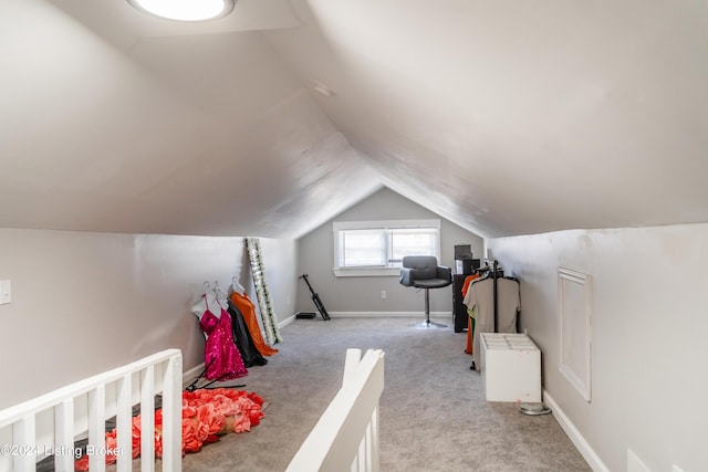 bedroom featuring vaulted ceiling, carpet, and baseboards