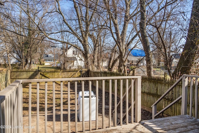 deck with a fenced backyard