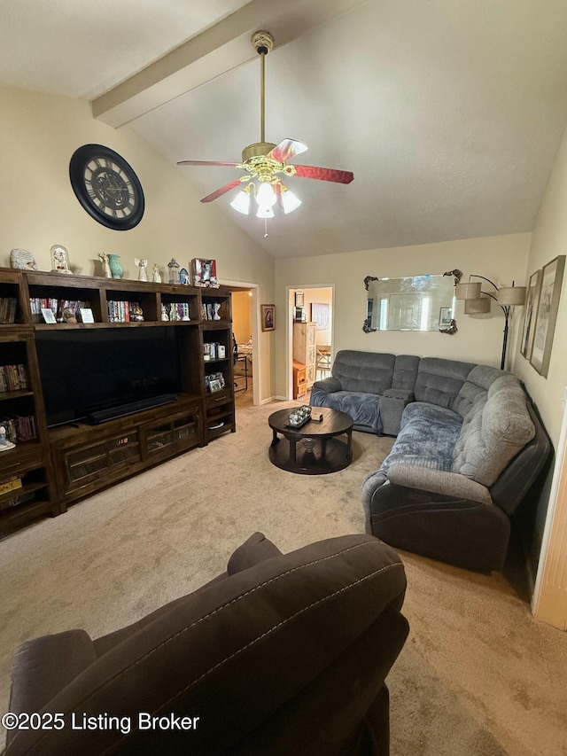 living area featuring lofted ceiling with beams, a ceiling fan, and carpet flooring