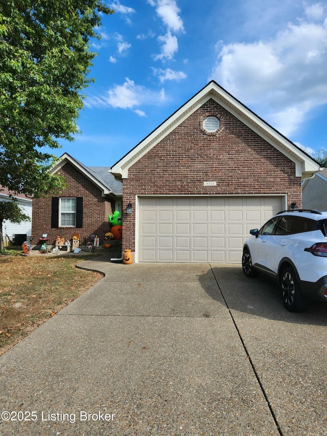 view of front of property with a garage, brick siding, and driveway